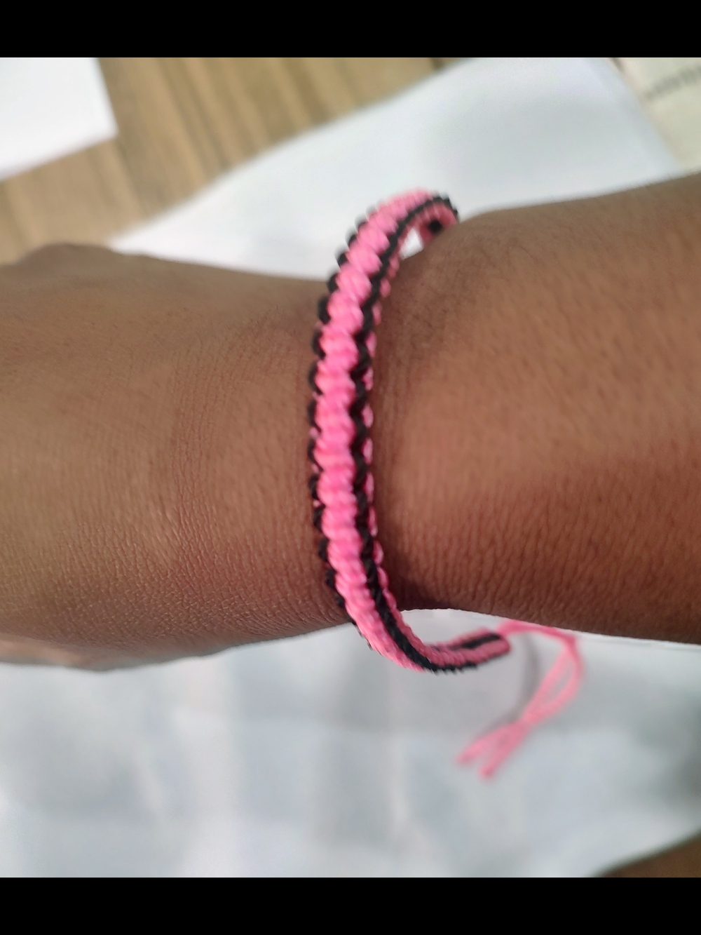 Handwoven Pink and Black Friendship Bracelet